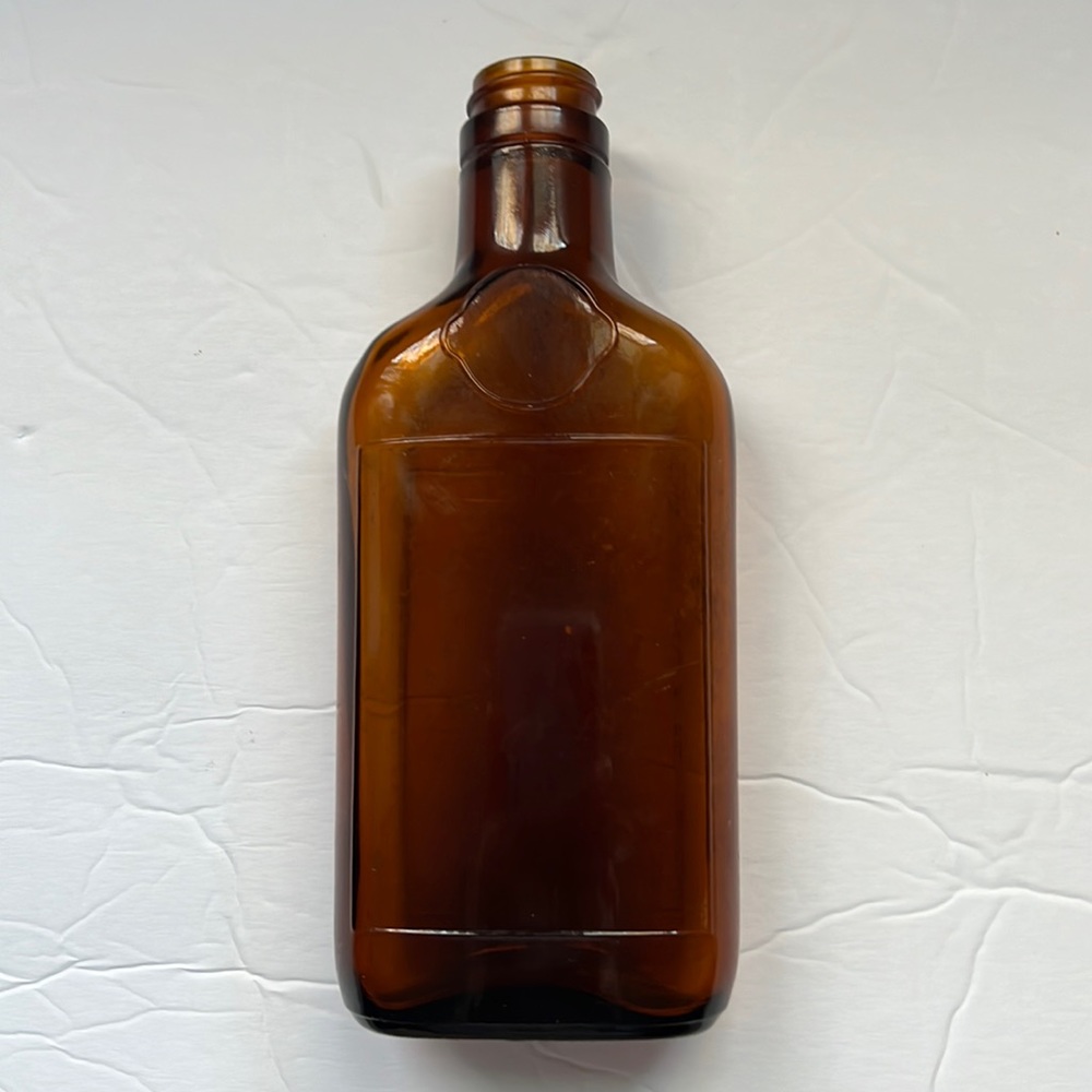 Vintage 1/2 pint amber glass whiskey bottle